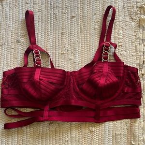 Red lingerie bra with gold accents